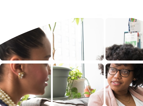 Provider listening attentively to a client in a warm, plant-filled space