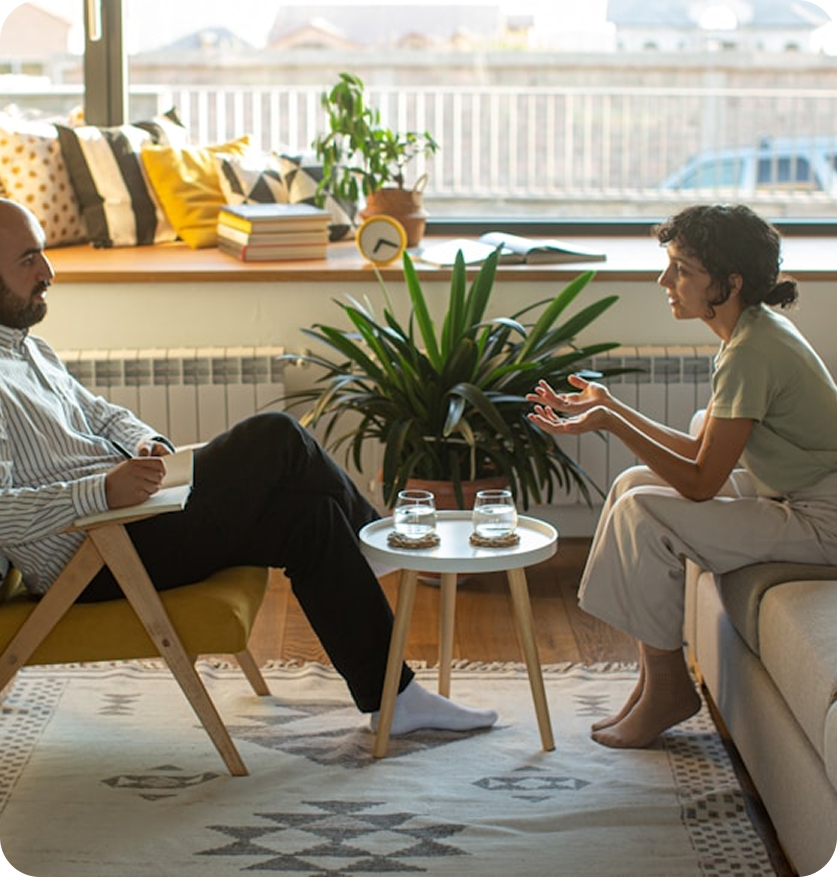 Family sitting together on a couch during a supportive conversation