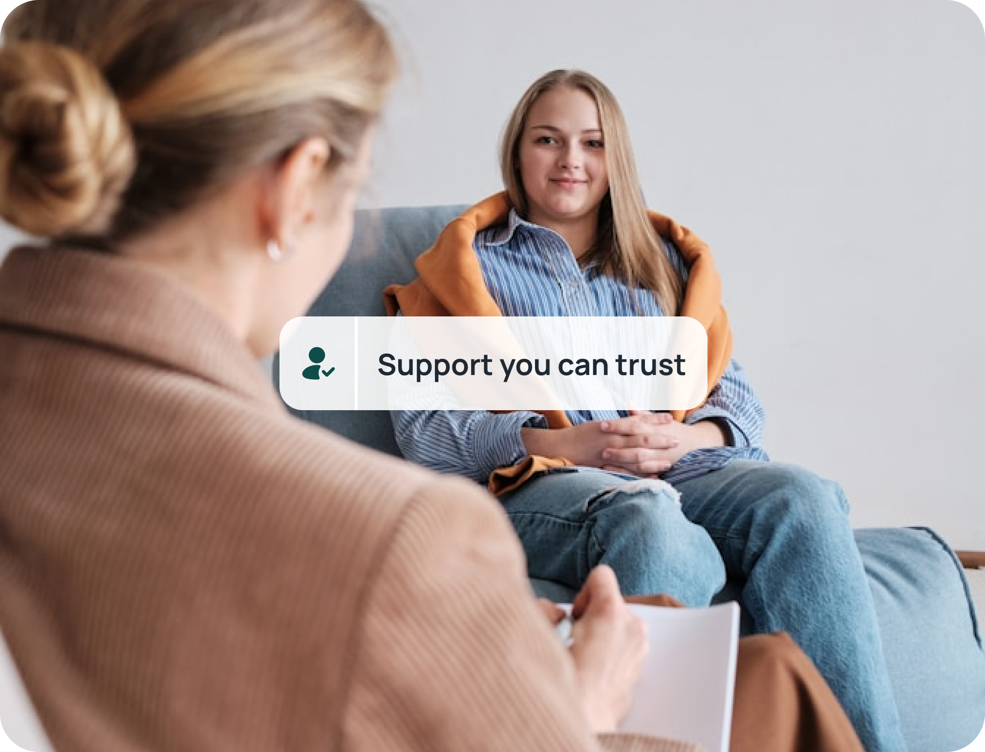 Therapist providing support to a client during a behavioral health session
